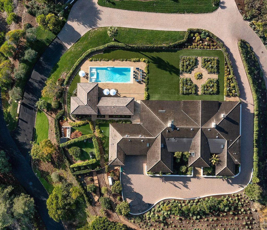2170 Ortega Ranch Lane Home in Santa Barbara, California. Unwind in the lap of luxury at this newly renovated, single-level estate boasting breathtaking panoramic views that stretch across the horizon. Step inside to discover a world of elegance, where gracious rooms and covered terraces seamlessly connect with the awe-inspiring vistas. Designed for both entertainment and relaxation, this extraordinary home offers a harmonious blend of public and private spaces.