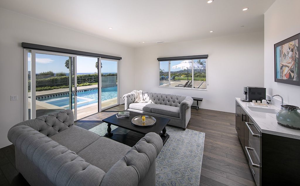 2170 Ortega Ranch Lane Home in Santa Barbara, California. Unwind in the lap of luxury at this newly renovated, single-level estate boasting breathtaking panoramic views that stretch across the horizon. Step inside to discover a world of elegance, where gracious rooms and covered terraces seamlessly connect with the awe-inspiring vistas. Designed for both entertainment and relaxation, this extraordinary home offers a harmonious blend of public and private spaces.
