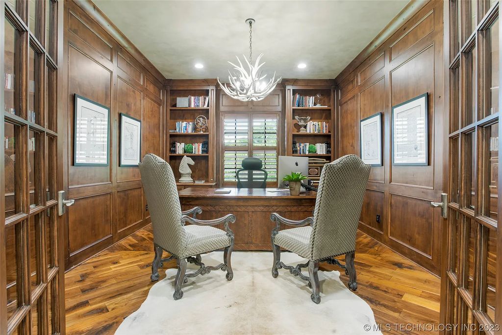 2411 E 34th Street Home in Tulsa, Oklahoma. Experience the epitome of luxury in this one-of-a-kind, majestic midtown mansion. Built in 2010, this stunning residence showcases high ceilings and bright, open rooms that overlook an incredible backyard oasis. Ideal for entertaining, the home features multiple game rooms, a theater, two gyms, a billiards room, and a cigar lounge with ventilation to the outside. Indulge in the 1,000-bottle wine room, relax by the spacious pool and spa, and enjoy outdoor dining with the convenient outdoor kitchen and covered living area.