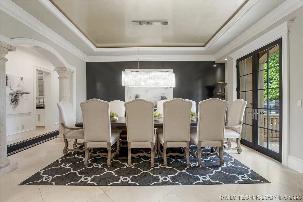 2411 E 34th Street Home in Tulsa, Oklahoma. Experience the epitome of luxury in this one-of-a-kind, majestic midtown mansion. Built in 2010, this stunning residence showcases high ceilings and bright, open rooms that overlook an incredible backyard oasis. Ideal for entertaining, the home features multiple game rooms, a theater, two gyms, a billiards room, and a cigar lounge with ventilation to the outside. Indulge in the 1,000-bottle wine room, relax by the spacious pool and spa, and enjoy outdoor dining with the convenient outdoor kitchen and covered living area.