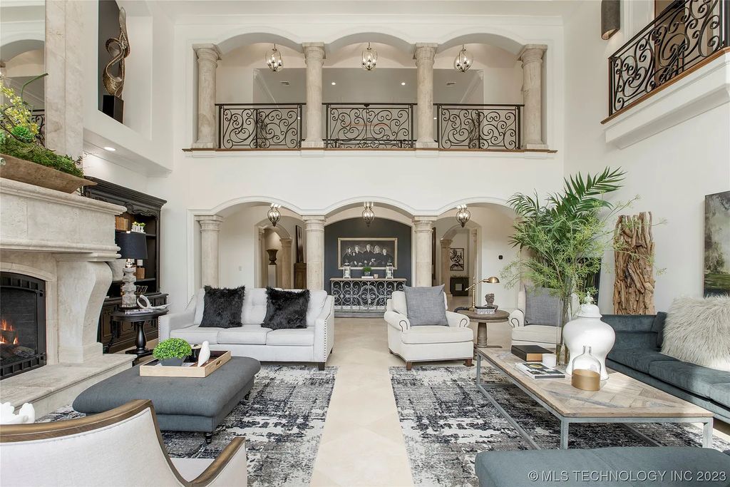 2411 E 34th Street Home in Tulsa, Oklahoma. Experience the epitome of luxury in this one-of-a-kind, majestic midtown mansion. Built in 2010, this stunning residence showcases high ceilings and bright, open rooms that overlook an incredible backyard oasis. Ideal for entertaining, the home features multiple game rooms, a theater, two gyms, a billiards room, and a cigar lounge with ventilation to the outside. Indulge in the 1,000-bottle wine room, relax by the spacious pool and spa, and enjoy outdoor dining with the convenient outdoor kitchen and covered living area.