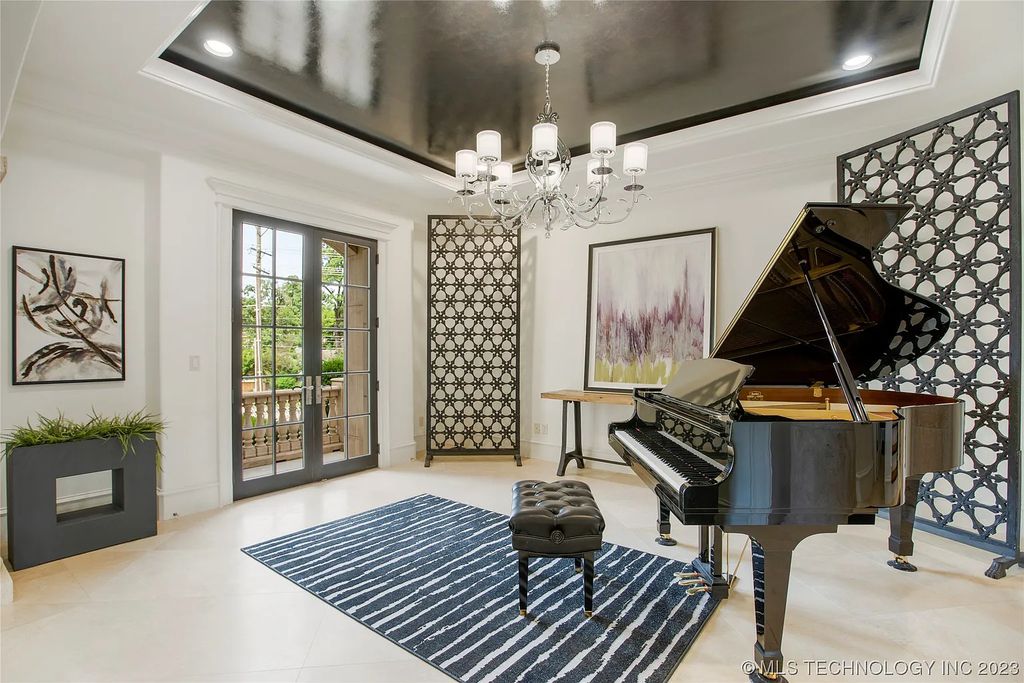 2411 E 34th Street Home in Tulsa, Oklahoma. Experience the epitome of luxury in this one-of-a-kind, majestic midtown mansion. Built in 2010, this stunning residence showcases high ceilings and bright, open rooms that overlook an incredible backyard oasis. Ideal for entertaining, the home features multiple game rooms, a theater, two gyms, a billiards room, and a cigar lounge with ventilation to the outside. Indulge in the 1,000-bottle wine room, relax by the spacious pool and spa, and enjoy outdoor dining with the convenient outdoor kitchen and covered living area.