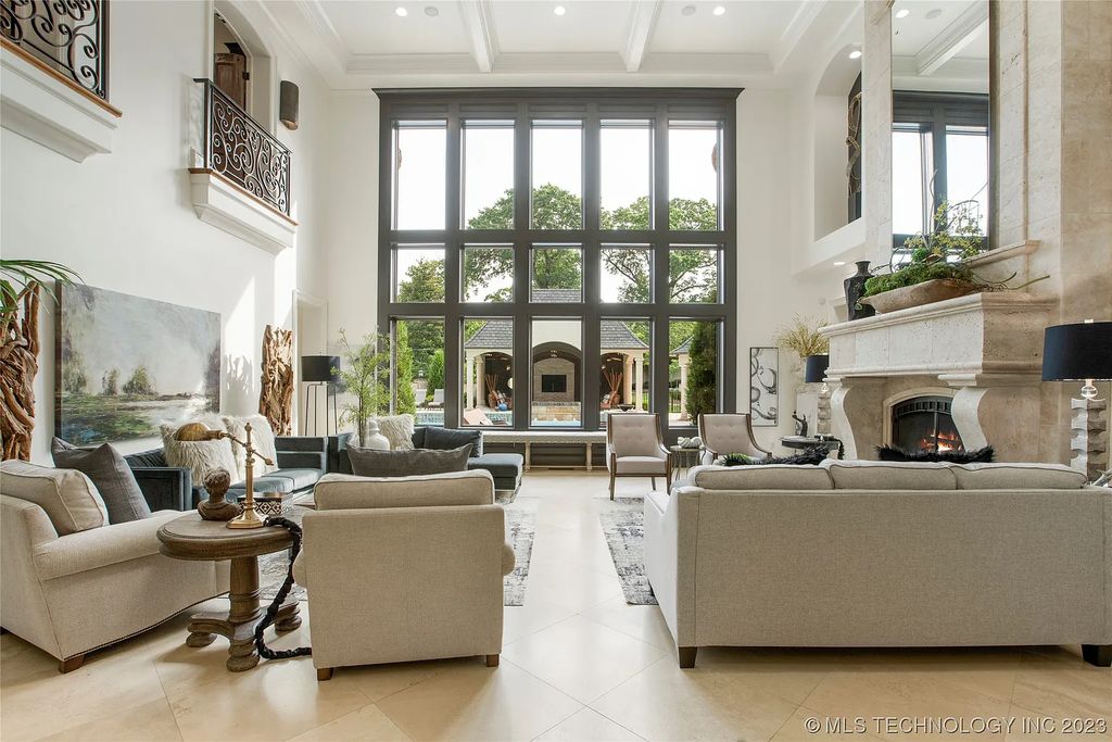 2411 E 34th Street Home in Tulsa, Oklahoma. Experience the epitome of luxury in this one-of-a-kind, majestic midtown mansion. Built in 2010, this stunning residence showcases high ceilings and bright, open rooms that overlook an incredible backyard oasis. Ideal for entertaining, the home features multiple game rooms, a theater, two gyms, a billiards room, and a cigar lounge with ventilation to the outside. Indulge in the 1,000-bottle wine room, relax by the spacious pool and spa, and enjoy outdoor dining with the convenient outdoor kitchen and covered living area.