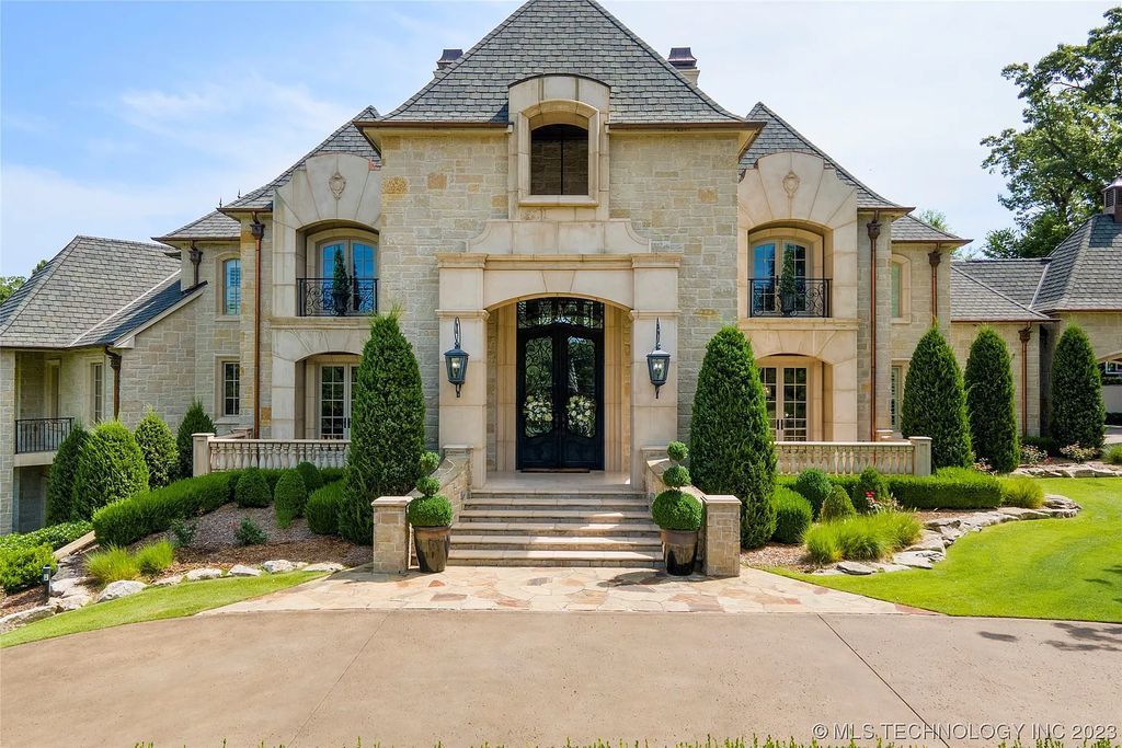 2411 E 34th Street Home in Tulsa, Oklahoma. Experience the epitome of luxury in this one-of-a-kind, majestic midtown mansion. Built in 2010, this stunning residence showcases high ceilings and bright, open rooms that overlook an incredible backyard oasis. Ideal for entertaining, the home features multiple game rooms, a theater, two gyms, a billiards room, and a cigar lounge with ventilation to the outside. Indulge in the 1,000-bottle wine room, relax by the spacious pool and spa, and enjoy outdoor dining with the convenient outdoor kitchen and covered living area.
