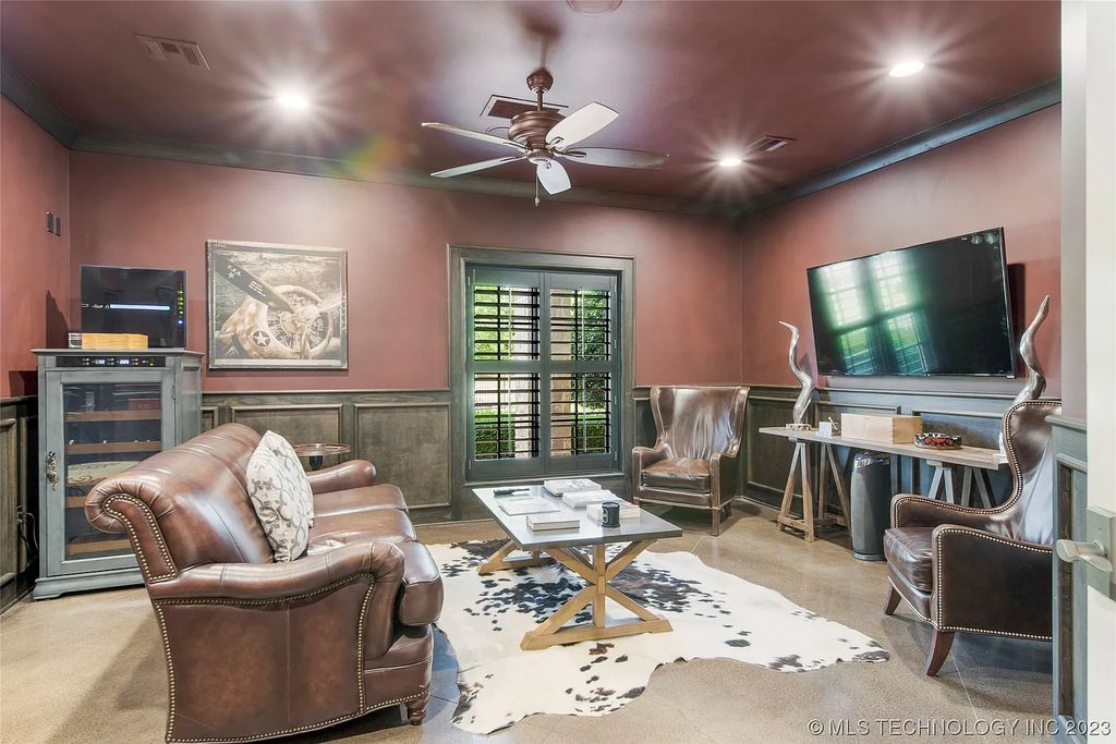 2411 E 34th Street Home in Tulsa, Oklahoma. Experience the epitome of luxury in this one-of-a-kind, majestic midtown mansion. Built in 2010, this stunning residence showcases high ceilings and bright, open rooms that overlook an incredible backyard oasis. Ideal for entertaining, the home features multiple game rooms, a theater, two gyms, a billiards room, and a cigar lounge with ventilation to the outside. Indulge in the 1,000-bottle wine room, relax by the spacious pool and spa, and enjoy outdoor dining with the convenient outdoor kitchen and covered living area.