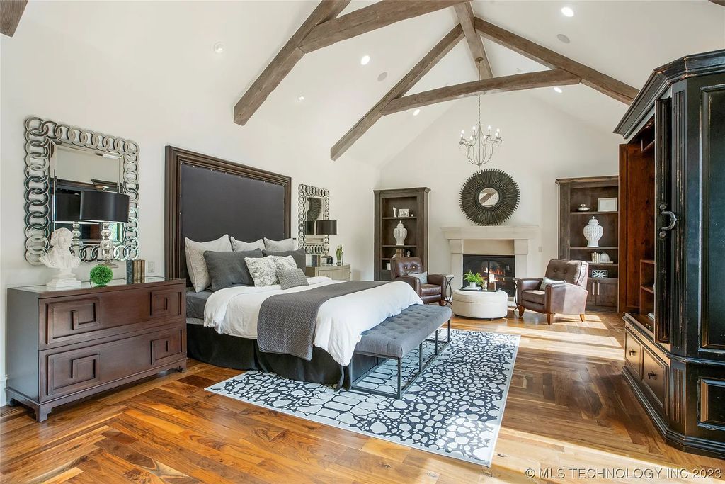 2411 E 34th Street Home in Tulsa, Oklahoma. Experience the epitome of luxury in this one-of-a-kind, majestic midtown mansion. Built in 2010, this stunning residence showcases high ceilings and bright, open rooms that overlook an incredible backyard oasis. Ideal for entertaining, the home features multiple game rooms, a theater, two gyms, a billiards room, and a cigar lounge with ventilation to the outside. Indulge in the 1,000-bottle wine room, relax by the spacious pool and spa, and enjoy outdoor dining with the convenient outdoor kitchen and covered living area.