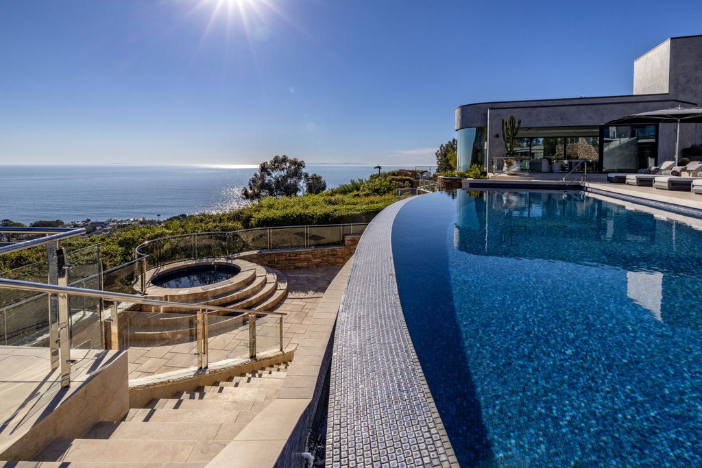 31401 Mar Vista Avenue Home in Laguna Beach, California. Located just minutes away from the prestigious Montage Laguna Beach resort, this unparalleled estate is situated in Southern California, offering stunning views of the Pacific Ocean and access to secluded beaches. Spread across 12 acres of native California landscape, this thoughtfully constructed property showcases exquisite design, abundant natural light, and a seamless integration with the surrounding environment.