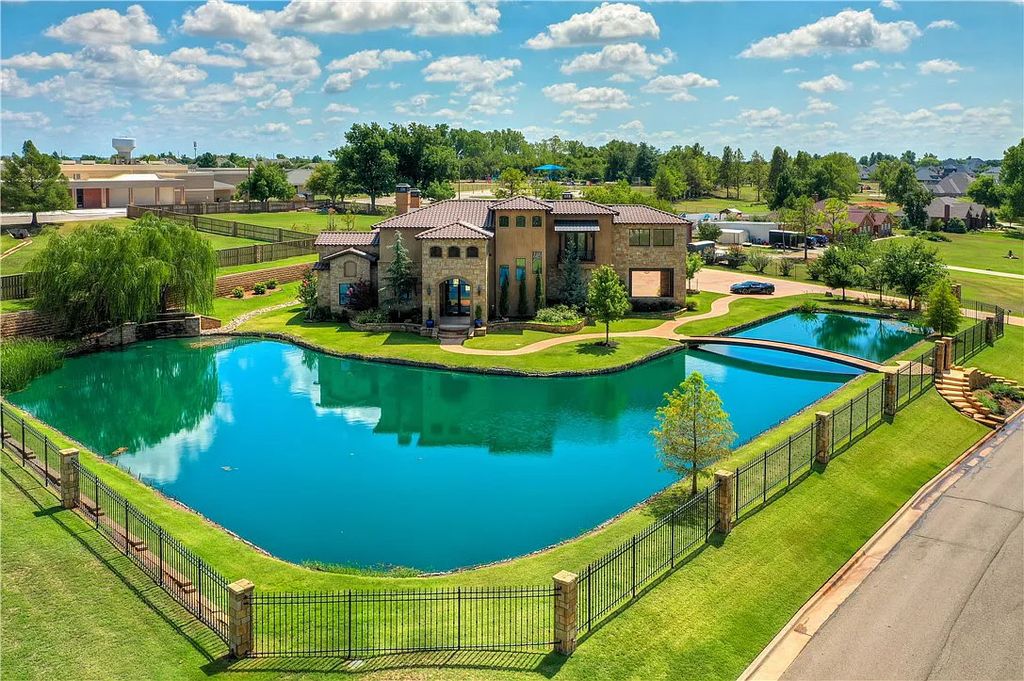 3507 Hillview Drive Home in Drive, Norman, Oklahoma. The home boasts picturesque views from the moment you approach it. Some of its exceptional features include a massive, aerated, and stocked pond that holds approximately 1 million gallons of water, premium finishes and appliances throughout, travertine flooring, two laundry rooms, rare and unique granite, 10-foot garage doors, a hydraulic elevator, spray foam insulation, automatic lighting in every closet, and a hot water recirculating system.