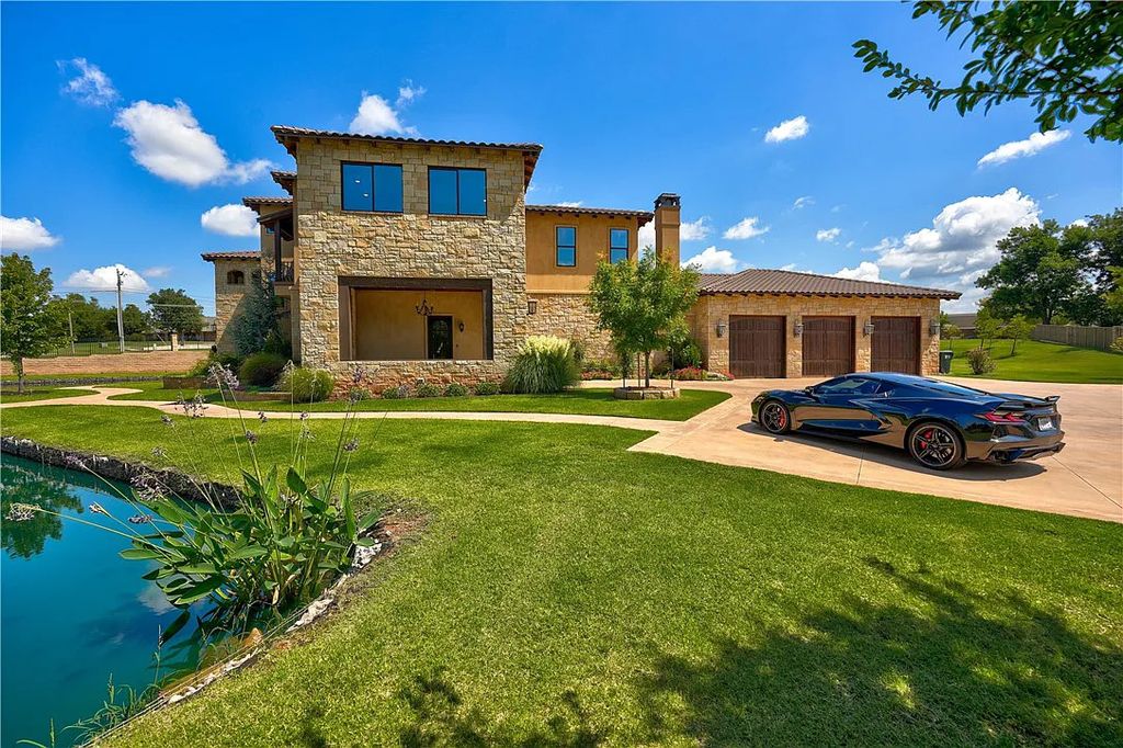 3507 Hillview Drive Home in Drive, Norman, Oklahoma. The home boasts picturesque views from the moment you approach it. Some of its exceptional features include a massive, aerated, and stocked pond that holds approximately 1 million gallons of water, premium finishes and appliances throughout, travertine flooring, two laundry rooms, rare and unique granite, 10-foot garage doors, a hydraulic elevator, spray foam insulation, automatic lighting in every closet, and a hot water recirculating system.