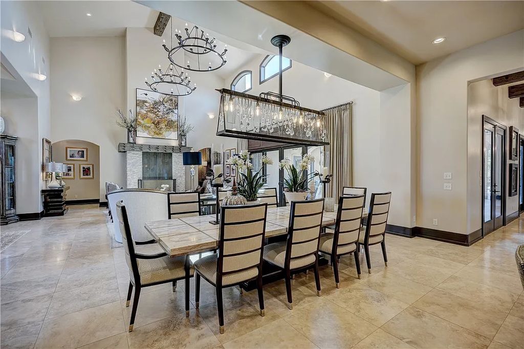 3507 Hillview Drive Home in Drive, Norman, Oklahoma. The home boasts picturesque views from the moment you approach it. Some of its exceptional features include a massive, aerated, and stocked pond that holds approximately 1 million gallons of water, premium finishes and appliances throughout, travertine flooring, two laundry rooms, rare and unique granite, 10-foot garage doors, a hydraulic elevator, spray foam insulation, automatic lighting in every closet, and a hot water recirculating system.