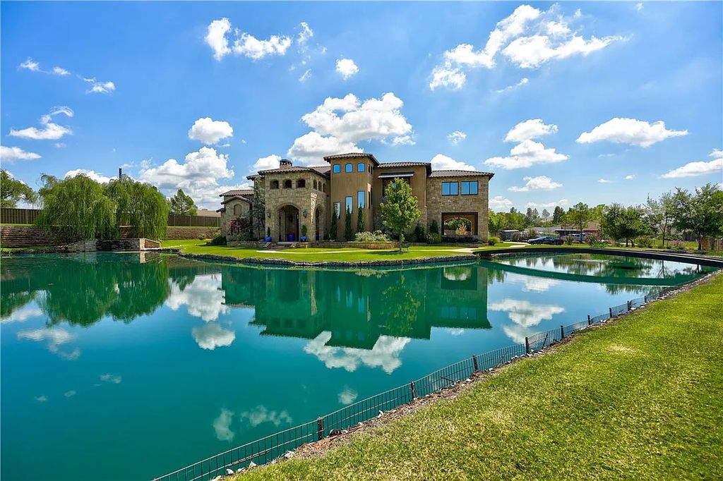 3507 Hillview Drive Home in Drive, Norman, Oklahoma. The home boasts picturesque views from the moment you approach it. Some of its exceptional features include a massive, aerated, and stocked pond that holds approximately 1 million gallons of water, premium finishes and appliances throughout, travertine flooring, two laundry rooms, rare and unique granite, 10-foot garage doors, a hydraulic elevator, spray foam insulation, automatic lighting in every closet, and a hot water recirculating system.