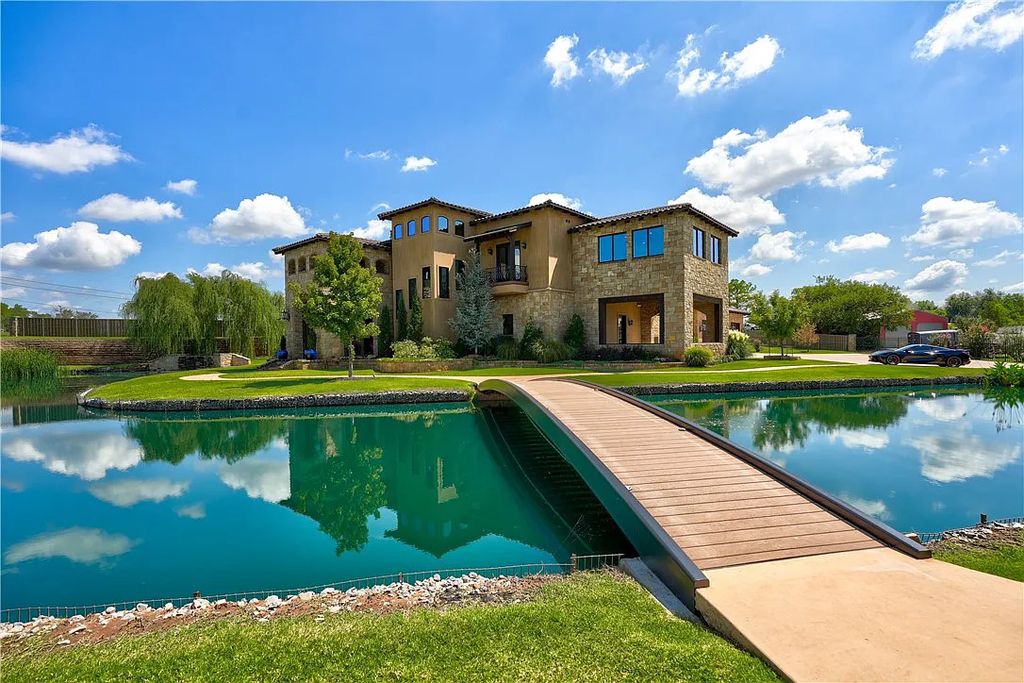 3507 Hillview Drive Home in Drive, Norman, Oklahoma. The home boasts picturesque views from the moment you approach it. Some of its exceptional features include a massive, aerated, and stocked pond that holds approximately 1 million gallons of water, premium finishes and appliances throughout, travertine flooring, two laundry rooms, rare and unique granite, 10-foot garage doors, a hydraulic elevator, spray foam insulation, automatic lighting in every closet, and a hot water recirculating system.