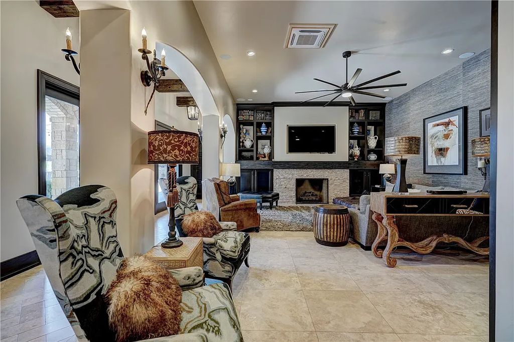 3507 Hillview Drive Home in Drive, Norman, Oklahoma. The home boasts picturesque views from the moment you approach it. Some of its exceptional features include a massive, aerated, and stocked pond that holds approximately 1 million gallons of water, premium finishes and appliances throughout, travertine flooring, two laundry rooms, rare and unique granite, 10-foot garage doors, a hydraulic elevator, spray foam insulation, automatic lighting in every closet, and a hot water recirculating system.