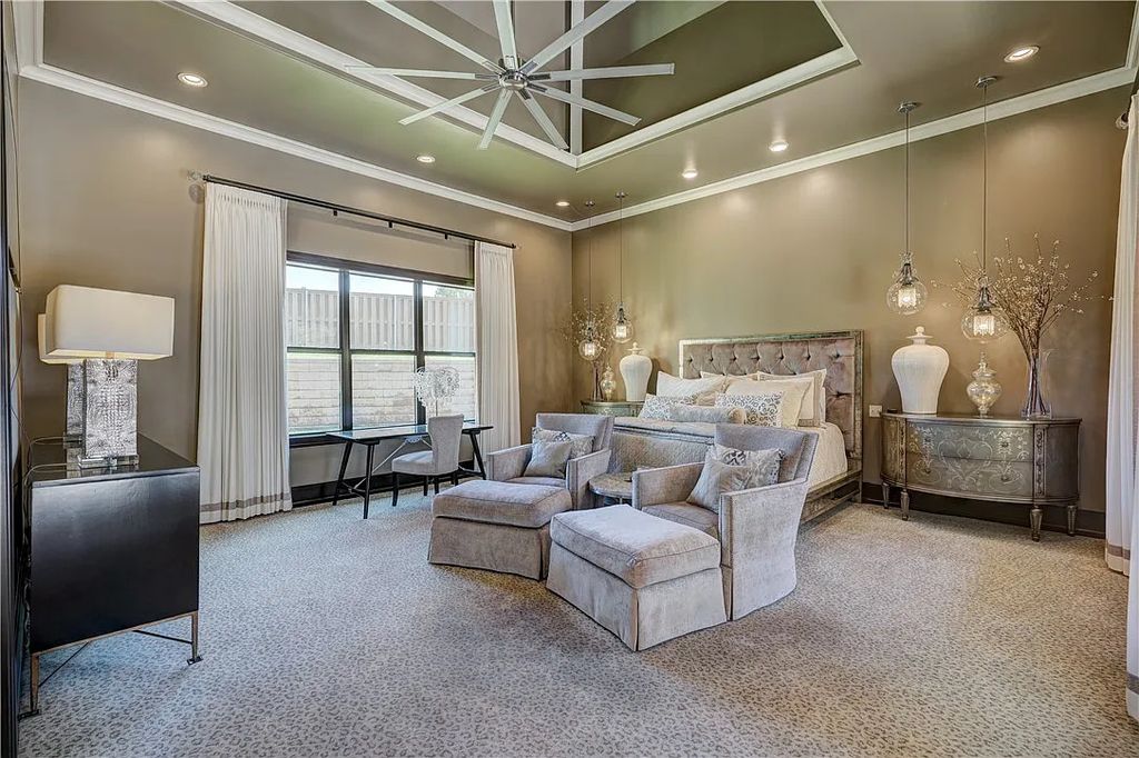 3507 Hillview Drive Home in Drive, Norman, Oklahoma. The home boasts picturesque views from the moment you approach it. Some of its exceptional features include a massive, aerated, and stocked pond that holds approximately 1 million gallons of water, premium finishes and appliances throughout, travertine flooring, two laundry rooms, rare and unique granite, 10-foot garage doors, a hydraulic elevator, spray foam insulation, automatic lighting in every closet, and a hot water recirculating system.
