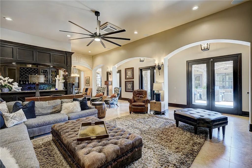 3507 Hillview Drive Home in Drive, Norman, Oklahoma. The home boasts picturesque views from the moment you approach it. Some of its exceptional features include a massive, aerated, and stocked pond that holds approximately 1 million gallons of water, premium finishes and appliances throughout, travertine flooring, two laundry rooms, rare and unique granite, 10-foot garage doors, a hydraulic elevator, spray foam insulation, automatic lighting in every closet, and a hot water recirculating system.