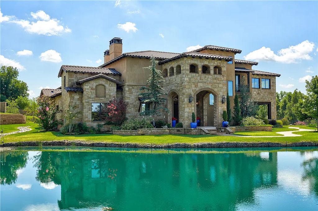 3507 Hillview Drive Home in Drive, Norman, Oklahoma. The home boasts picturesque views from the moment you approach it. Some of its exceptional features include a massive, aerated, and stocked pond that holds approximately 1 million gallons of water, premium finishes and appliances throughout, travertine flooring, two laundry rooms, rare and unique granite, 10-foot garage doors, a hydraulic elevator, spray foam insulation, automatic lighting in every closet, and a hot water recirculating system.