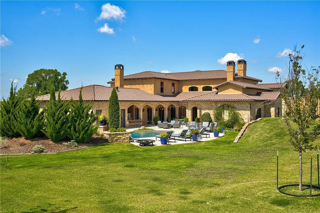 3507 Hillview Drive Home in Drive, Norman, Oklahoma. The home boasts picturesque views from the moment you approach it. Some of its exceptional features include a massive, aerated, and stocked pond that holds approximately 1 million gallons of water, premium finishes and appliances throughout, travertine flooring, two laundry rooms, rare and unique granite, 10-foot garage doors, a hydraulic elevator, spray foam insulation, automatic lighting in every closet, and a hot water recirculating system.