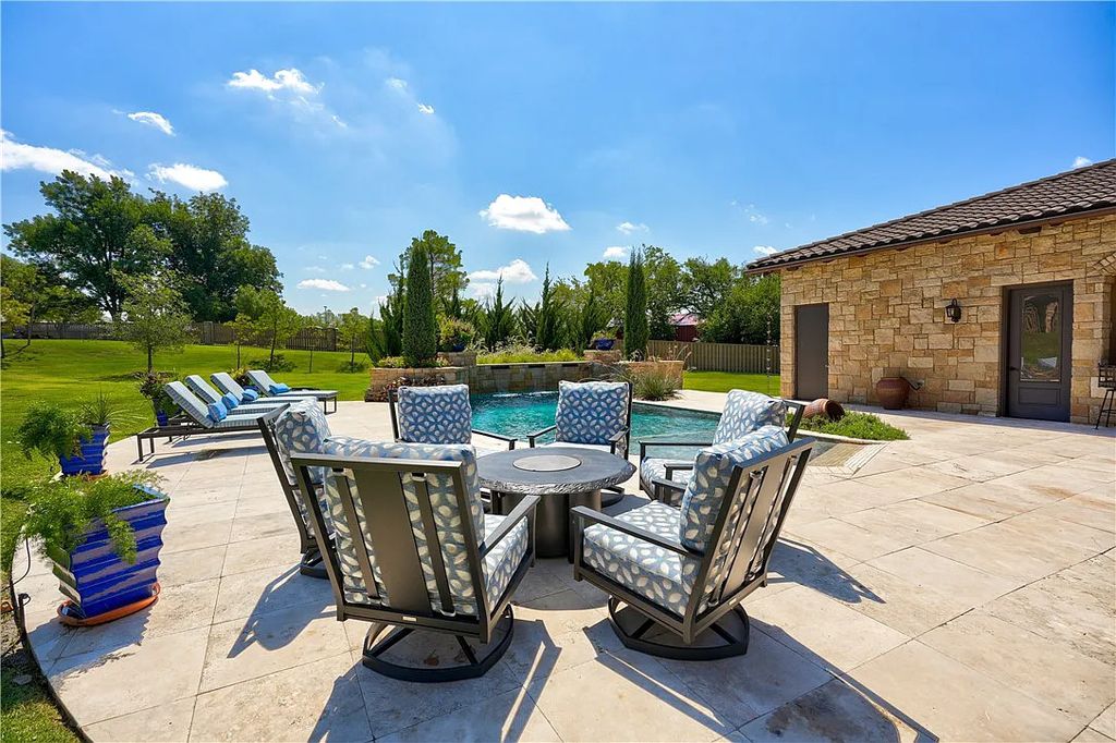 3507 Hillview Drive Home in Drive, Norman, Oklahoma. The home boasts picturesque views from the moment you approach it. Some of its exceptional features include a massive, aerated, and stocked pond that holds approximately 1 million gallons of water, premium finishes and appliances throughout, travertine flooring, two laundry rooms, rare and unique granite, 10-foot garage doors, a hydraulic elevator, spray foam insulation, automatic lighting in every closet, and a hot water recirculating system.