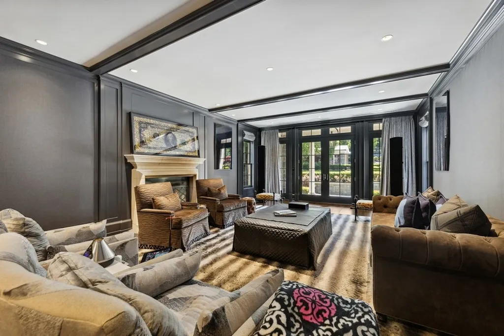 363 Lydecker Street Home in Englewood, New Jersey. This magnificent estate captivates with its stunning granite stone exterior, slate roof, and copper gutters. Inside, indulge in opulent amenities including a Christopher Peacock kitchen, media room, and library with an attached 5-car garage gallery. The home features a complete Crestron home automation and security system, a 3000-bottle wine cellar, elevator, and 9 fireplaces.