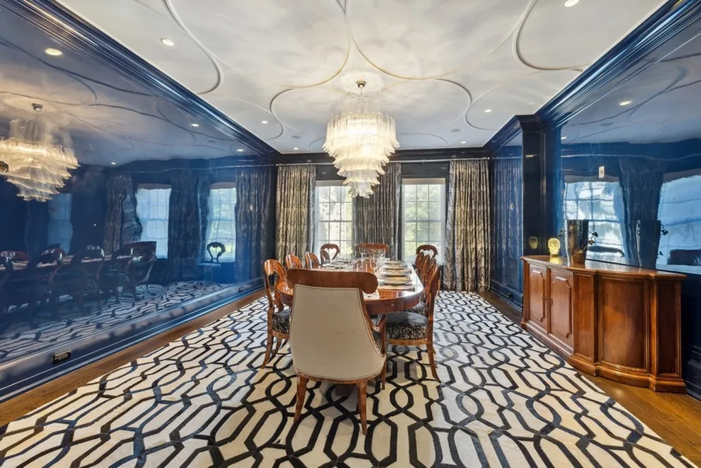363 Lydecker Street Home in Englewood, New Jersey. This magnificent estate captivates with its stunning granite stone exterior, slate roof, and copper gutters. Inside, indulge in opulent amenities including a Christopher Peacock kitchen, media room, and library with an attached 5-car garage gallery. The home features a complete Crestron home automation and security system, a 3000-bottle wine cellar, elevator, and 9 fireplaces.