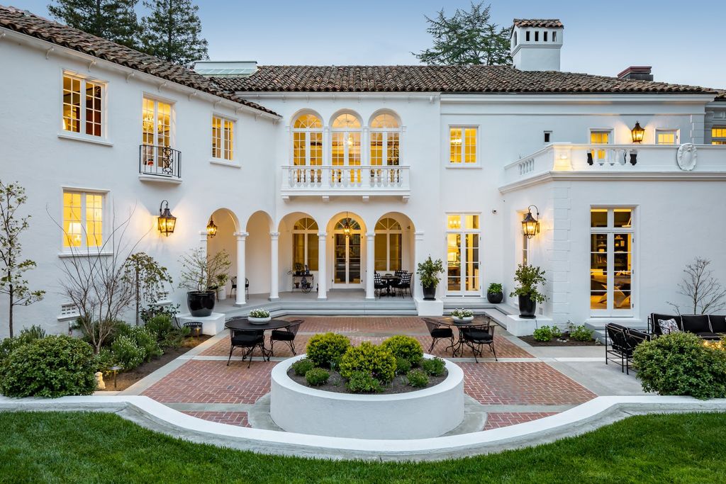 395 Hampton Road Home in Piedmont, California. The property has been expertly modernized while still maintaining its elegant provenance, with features such as custom cabinetry, marble countertops, and premium fixtures and appliances. The house boasts a newly renovated and expanded kitchen, formal living and dining rooms, and sweeping outdoor patios. 