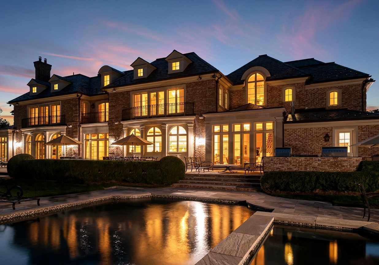 4 Stone Tower Drive Home in Alpine, New Jersey. Discover the epitome of luxury living at the majestic Alpine estate, one of the finest homes in Northern Bergen County. Set on 4 gated manicured acres in Rio Vista, this impeccably designed manor by James Paragono showcases architectural excellence and meticulous craftsmanship. With 22,782 square feet of opulent living space spread across 4 levels, this estate boasts 12' ceilings, luxurious amenities, and breathtaking features, including a pool, cabana, tennis court, guest house, and putting green. The residence offers garage parking for 8 cars, an elevator servicing all floors, 25 rooms, a new Salerno kitchen, 8 bedrooms, 9 full and 3 half baths, bowling alleys, a home theater, a commercial generator, and state-of-the-art high-efficiency furnaces.