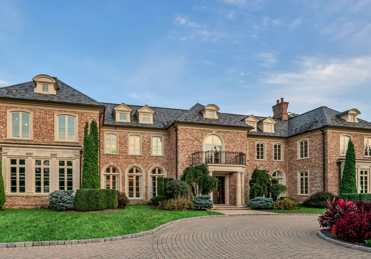 4 Stone Tower Drive Home in Alpine, New Jersey. Discover the epitome of luxury living at the majestic Alpine estate, one of the finest homes in Northern Bergen County. Set on 4 gated manicured acres in Rio Vista, this impeccably designed manor by James Paragono showcases architectural excellence and meticulous craftsmanship. With 22,782 square feet of opulent living space spread across 4 levels, this estate boasts 12' ceilings, luxurious amenities, and breathtaking features, including a pool, cabana, tennis court, guest house, and putting green. The residence offers garage parking for 8 cars, an elevator servicing all floors, 25 rooms, a new Salerno kitchen, 8 bedrooms, 9 full and 3 half baths, bowling alleys, a home theater, a commercial generator, and state-of-the-art high-efficiency furnaces.