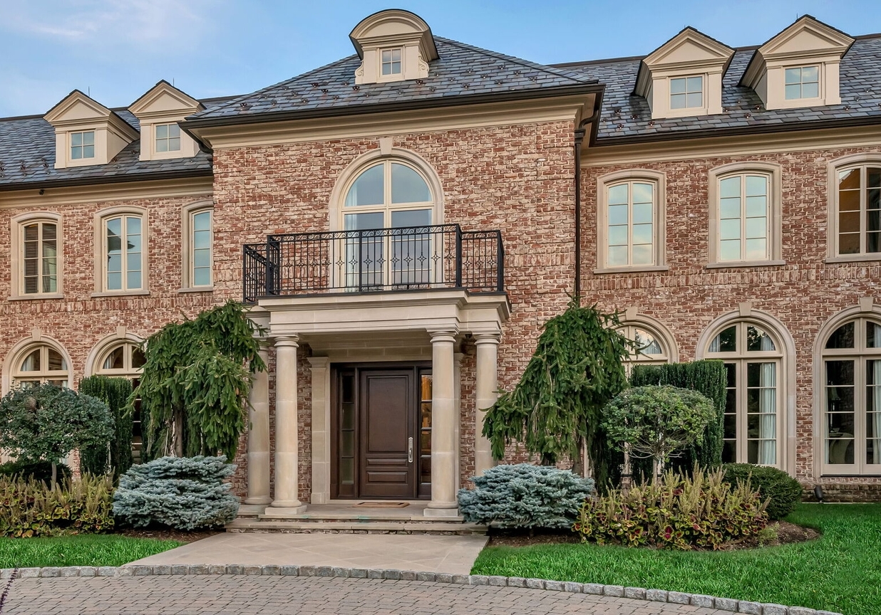 4 Stone Tower Drive Home in Alpine, New Jersey. Discover the epitome of luxury living at the majestic Alpine estate, one of the finest homes in Northern Bergen County. Set on 4 gated manicured acres in Rio Vista, this impeccably designed manor by James Paragono showcases architectural excellence and meticulous craftsmanship. With 22,782 square feet of opulent living space spread across 4 levels, this estate boasts 12' ceilings, luxurious amenities, and breathtaking features, including a pool, cabana, tennis court, guest house, and putting green. The residence offers garage parking for 8 cars, an elevator servicing all floors, 25 rooms, a new Salerno kitchen, 8 bedrooms, 9 full and 3 half baths, bowling alleys, a home theater, a commercial generator, and state-of-the-art high-efficiency furnaces.
