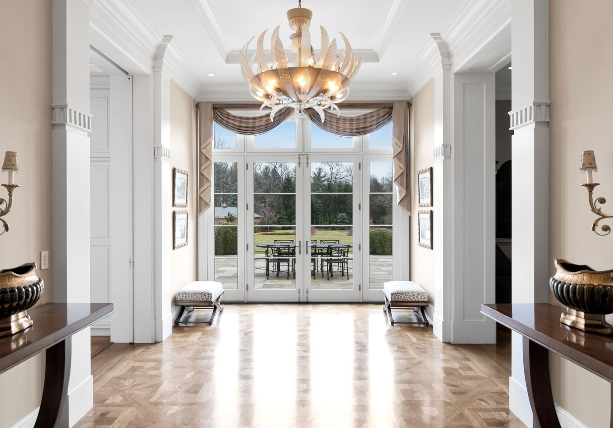 4 Stone Tower Drive Home in Alpine, New Jersey. Discover the epitome of luxury living at the majestic Alpine estate, one of the finest homes in Northern Bergen County. Set on 4 gated manicured acres in Rio Vista, this impeccably designed manor by James Paragono showcases architectural excellence and meticulous craftsmanship. With 22,782 square feet of opulent living space spread across 4 levels, this estate boasts 12' ceilings, luxurious amenities, and breathtaking features, including a pool, cabana, tennis court, guest house, and putting green. The residence offers garage parking for 8 cars, an elevator servicing all floors, 25 rooms, a new Salerno kitchen, 8 bedrooms, 9 full and 3 half baths, bowling alleys, a home theater, a commercial generator, and state-of-the-art high-efficiency furnaces.