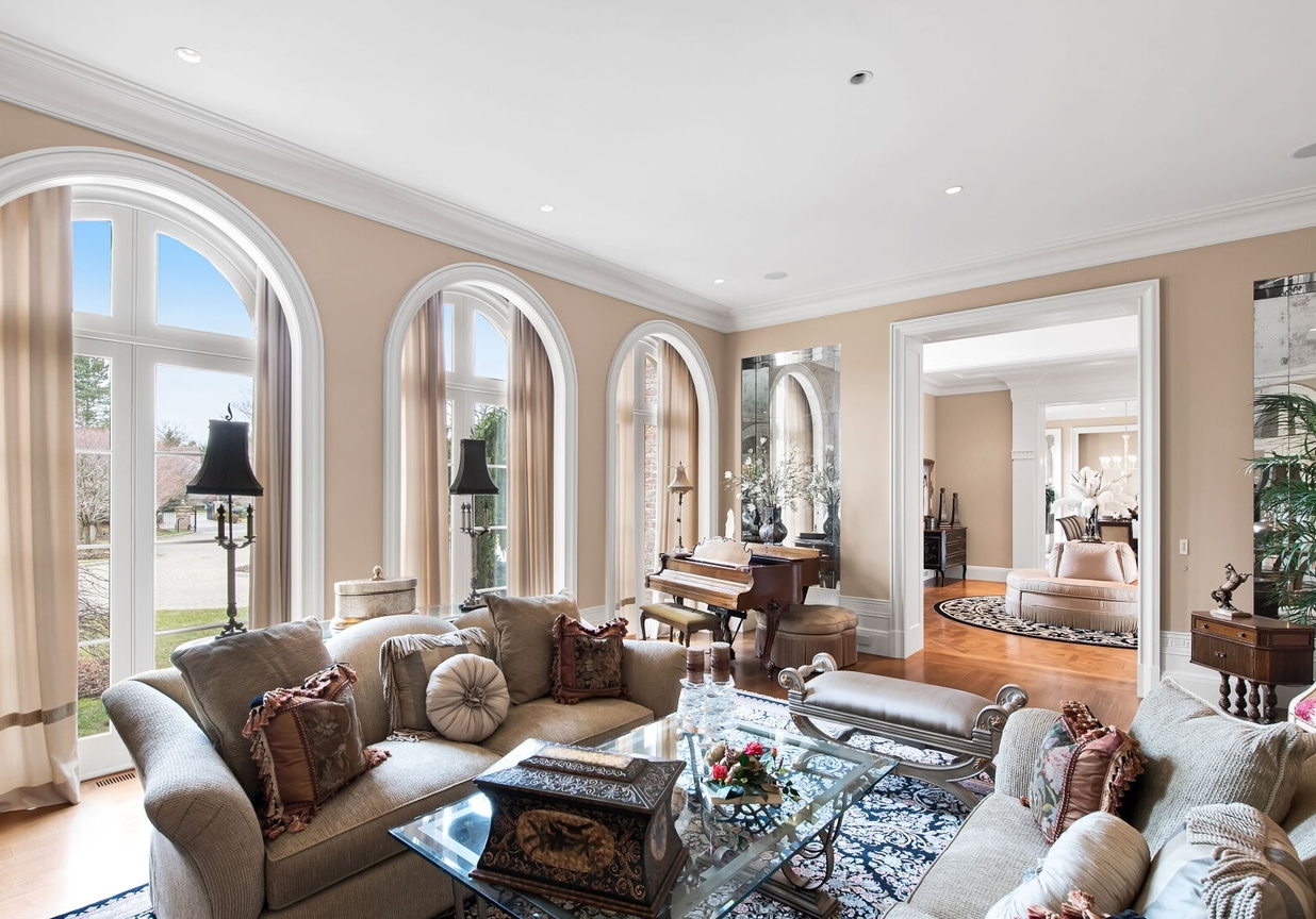 4 Stone Tower Drive Home in Alpine, New Jersey. Discover the epitome of luxury living at the majestic Alpine estate, one of the finest homes in Northern Bergen County. Set on 4 gated manicured acres in Rio Vista, this impeccably designed manor by James Paragono showcases architectural excellence and meticulous craftsmanship. With 22,782 square feet of opulent living space spread across 4 levels, this estate boasts 12' ceilings, luxurious amenities, and breathtaking features, including a pool, cabana, tennis court, guest house, and putting green. The residence offers garage parking for 8 cars, an elevator servicing all floors, 25 rooms, a new Salerno kitchen, 8 bedrooms, 9 full and 3 half baths, bowling alleys, a home theater, a commercial generator, and state-of-the-art high-efficiency furnaces.