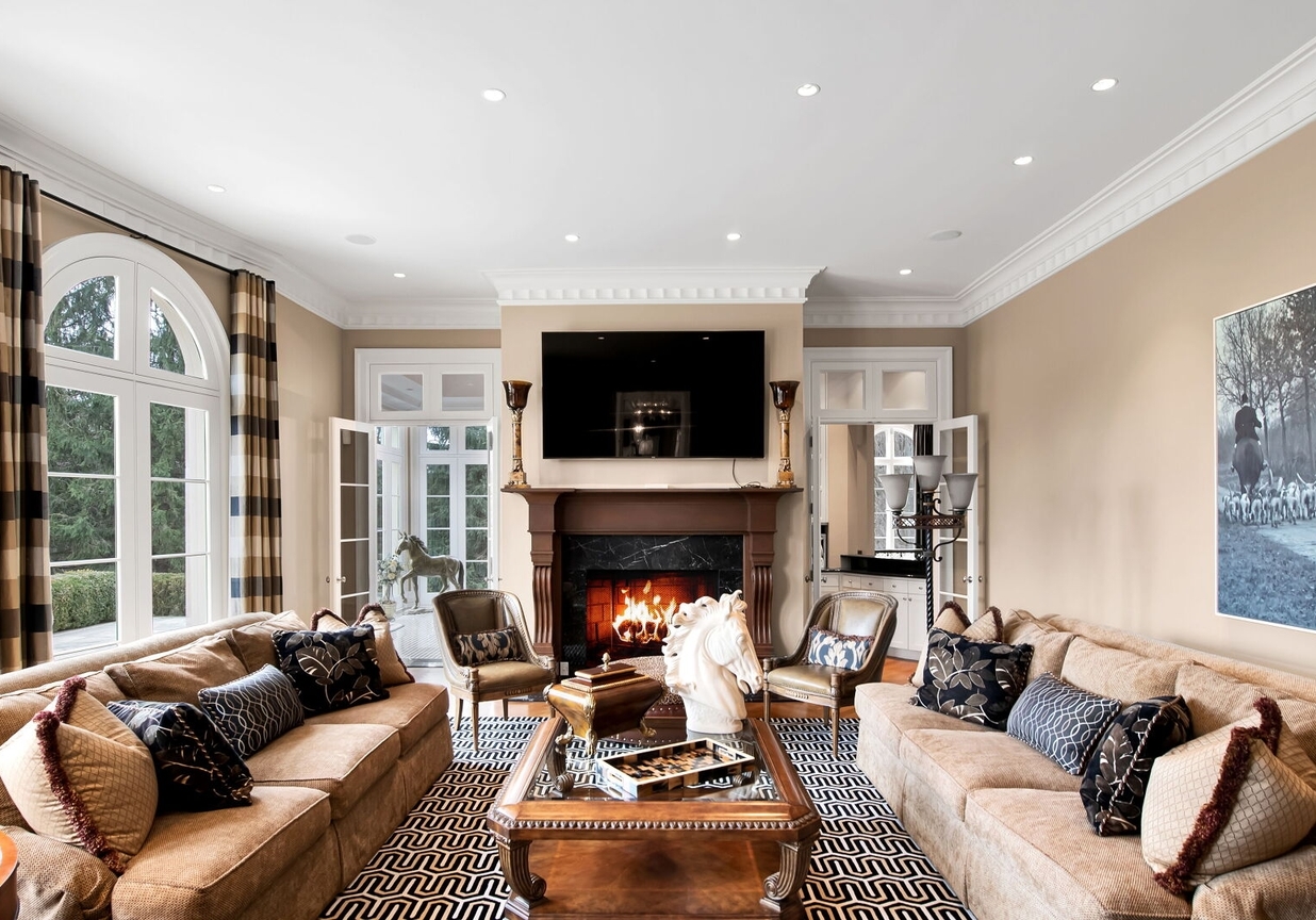 4 Stone Tower Drive Home in Alpine, New Jersey. Discover the epitome of luxury living at the majestic Alpine estate, one of the finest homes in Northern Bergen County. Set on 4 gated manicured acres in Rio Vista, this impeccably designed manor by James Paragono showcases architectural excellence and meticulous craftsmanship. With 22,782 square feet of opulent living space spread across 4 levels, this estate boasts 12' ceilings, luxurious amenities, and breathtaking features, including a pool, cabana, tennis court, guest house, and putting green. The residence offers garage parking for 8 cars, an elevator servicing all floors, 25 rooms, a new Salerno kitchen, 8 bedrooms, 9 full and 3 half baths, bowling alleys, a home theater, a commercial generator, and state-of-the-art high-efficiency furnaces.