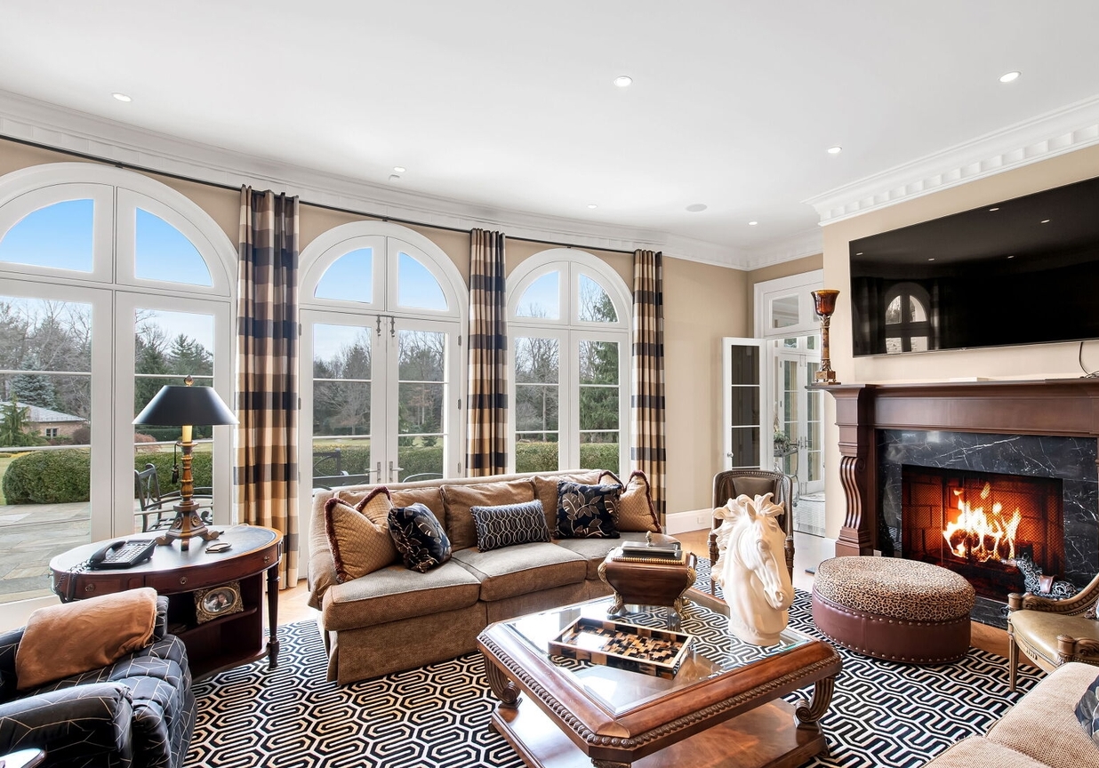 4 Stone Tower Drive Home in Alpine, New Jersey. Discover the epitome of luxury living at the majestic Alpine estate, one of the finest homes in Northern Bergen County. Set on 4 gated manicured acres in Rio Vista, this impeccably designed manor by James Paragono showcases architectural excellence and meticulous craftsmanship. With 22,782 square feet of opulent living space spread across 4 levels, this estate boasts 12' ceilings, luxurious amenities, and breathtaking features, including a pool, cabana, tennis court, guest house, and putting green. The residence offers garage parking for 8 cars, an elevator servicing all floors, 25 rooms, a new Salerno kitchen, 8 bedrooms, 9 full and 3 half baths, bowling alleys, a home theater, a commercial generator, and state-of-the-art high-efficiency furnaces.