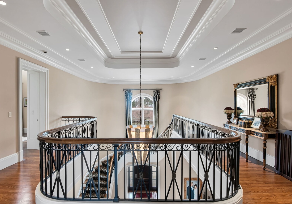 4 Stone Tower Drive Home in Alpine, New Jersey. Discover the epitome of luxury living at the majestic Alpine estate, one of the finest homes in Northern Bergen County. Set on 4 gated manicured acres in Rio Vista, this impeccably designed manor by James Paragono showcases architectural excellence and meticulous craftsmanship. With 22,782 square feet of opulent living space spread across 4 levels, this estate boasts 12' ceilings, luxurious amenities, and breathtaking features, including a pool, cabana, tennis court, guest house, and putting green. The residence offers garage parking for 8 cars, an elevator servicing all floors, 25 rooms, a new Salerno kitchen, 8 bedrooms, 9 full and 3 half baths, bowling alleys, a home theater, a commercial generator, and state-of-the-art high-efficiency furnaces.