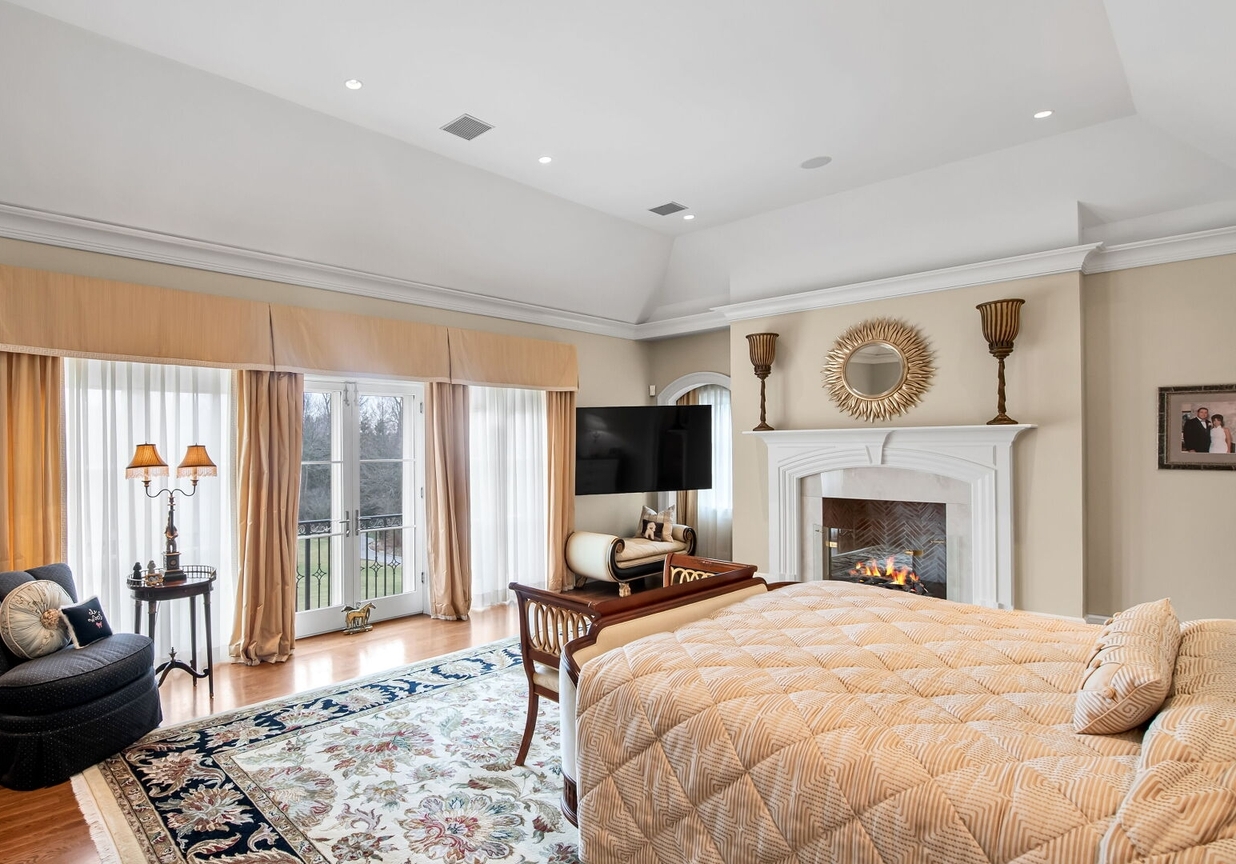 4 Stone Tower Drive Home in Alpine, New Jersey. Discover the epitome of luxury living at the majestic Alpine estate, one of the finest homes in Northern Bergen County. Set on 4 gated manicured acres in Rio Vista, this impeccably designed manor by James Paragono showcases architectural excellence and meticulous craftsmanship. With 22,782 square feet of opulent living space spread across 4 levels, this estate boasts 12' ceilings, luxurious amenities, and breathtaking features, including a pool, cabana, tennis court, guest house, and putting green. The residence offers garage parking for 8 cars, an elevator servicing all floors, 25 rooms, a new Salerno kitchen, 8 bedrooms, 9 full and 3 half baths, bowling alleys, a home theater, a commercial generator, and state-of-the-art high-efficiency furnaces.