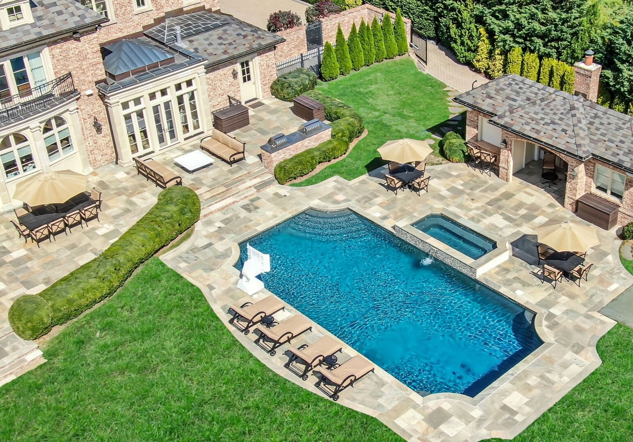 4 Stone Tower Drive Home in Alpine, New Jersey. Discover the epitome of luxury living at the majestic Alpine estate, one of the finest homes in Northern Bergen County. Set on 4 gated manicured acres in Rio Vista, this impeccably designed manor by James Paragono showcases architectural excellence and meticulous craftsmanship. With 22,782 square feet of opulent living space spread across 4 levels, this estate boasts 12' ceilings, luxurious amenities, and breathtaking features, including a pool, cabana, tennis court, guest house, and putting green. The residence offers garage parking for 8 cars, an elevator servicing all floors, 25 rooms, a new Salerno kitchen, 8 bedrooms, 9 full and 3 half baths, bowling alleys, a home theater, a commercial generator, and state-of-the-art high-efficiency furnaces.