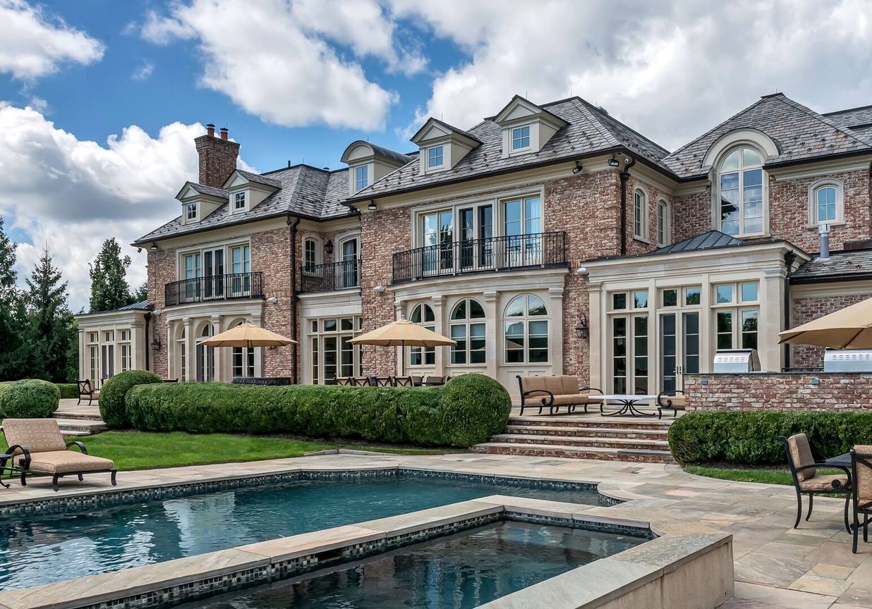 4 Stone Tower Drive Home in Alpine, New Jersey. Discover the epitome of luxury living at the majestic Alpine estate, one of the finest homes in Northern Bergen County. Set on 4 gated manicured acres in Rio Vista, this impeccably designed manor by James Paragono showcases architectural excellence and meticulous craftsmanship. With 22,782 square feet of opulent living space spread across 4 levels, this estate boasts 12' ceilings, luxurious amenities, and breathtaking features, including a pool, cabana, tennis court, guest house, and putting green. The residence offers garage parking for 8 cars, an elevator servicing all floors, 25 rooms, a new Salerno kitchen, 8 bedrooms, 9 full and 3 half baths, bowling alleys, a home theater, a commercial generator, and state-of-the-art high-efficiency furnaces.