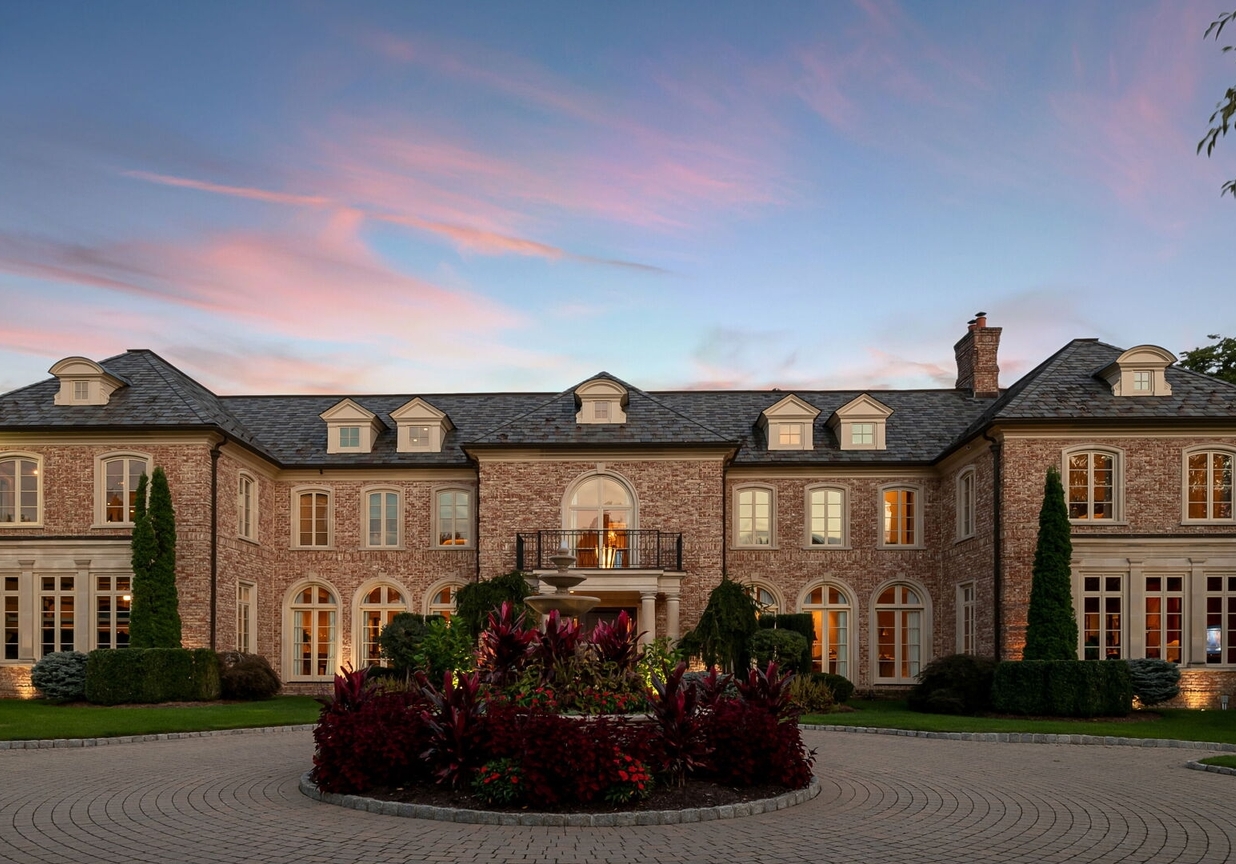 4 Stone Tower Drive Home in Alpine, New Jersey. Discover the epitome of luxury living at the majestic Alpine estate, one of the finest homes in Northern Bergen County. Set on 4 gated manicured acres in Rio Vista, this impeccably designed manor by James Paragono showcases architectural excellence and meticulous craftsmanship. With 22,782 square feet of opulent living space spread across 4 levels, this estate boasts 12' ceilings, luxurious amenities, and breathtaking features, including a pool, cabana, tennis court, guest house, and putting green. The residence offers garage parking for 8 cars, an elevator servicing all floors, 25 rooms, a new Salerno kitchen, 8 bedrooms, 9 full and 3 half baths, bowling alleys, a home theater, a commercial generator, and state-of-the-art high-efficiency furnaces.