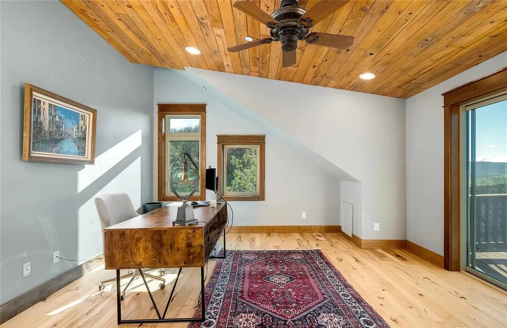 45200 Diamondback Way Home in Steamboat Springs, Colorado. Escape to a tranquil mountain retreat on Diamondback Way, offering breathtaking views and complete privacy just minutes from downtown Steamboat. This expansive property boasts 40 acres, hiking trails, and outdoor living spaces. The home features a great room with vaulted ceilings, a central kitchen for entertaining, and 6 bedrooms including primary suites. Enjoy the outdoors with a fire pit, hot tub, and acres of land for recreation. Horses are welcome, and the property has a high-producing well. Embrace the beauty of Steamboat's natural surroundings at this remarkable retreat.