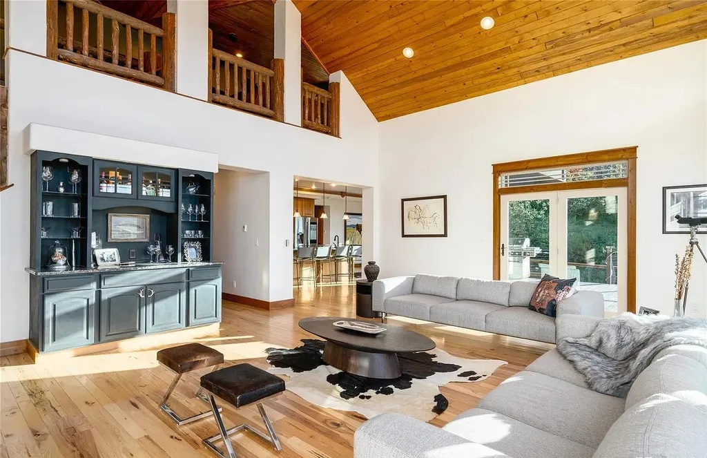 45200 Diamondback Way Home in Steamboat Springs, Colorado. Escape to a tranquil mountain retreat on Diamondback Way, offering breathtaking views and complete privacy just minutes from downtown Steamboat. This expansive property boasts 40 acres, hiking trails, and outdoor living spaces. The home features a great room with vaulted ceilings, a central kitchen for entertaining, and 6 bedrooms including primary suites. Enjoy the outdoors with a fire pit, hot tub, and acres of land for recreation. Horses are welcome, and the property has a high-producing well. Embrace the beauty of Steamboat's natural surroundings at this remarkable retreat.