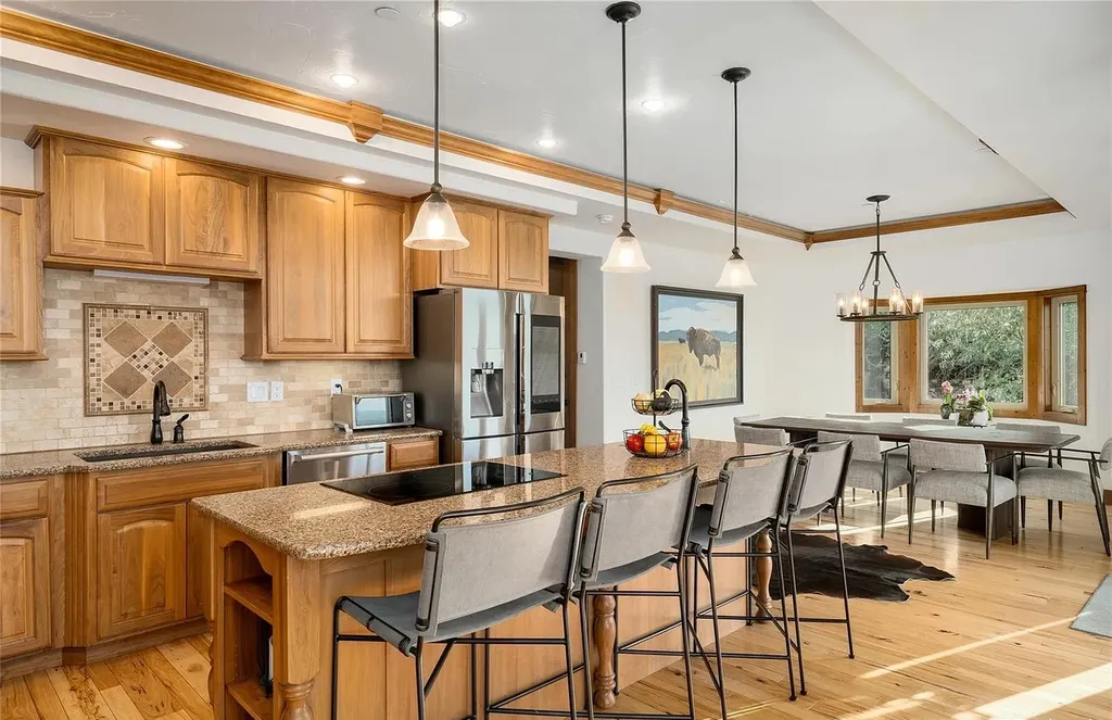 45200 Diamondback Way Home in Steamboat Springs, Colorado. Escape to a tranquil mountain retreat on Diamondback Way, offering breathtaking views and complete privacy just minutes from downtown Steamboat. This expansive property boasts 40 acres, hiking trails, and outdoor living spaces. The home features a great room with vaulted ceilings, a central kitchen for entertaining, and 6 bedrooms including primary suites. Enjoy the outdoors with a fire pit, hot tub, and acres of land for recreation. Horses are welcome, and the property has a high-producing well. Embrace the beauty of Steamboat's natural surroundings at this remarkable retreat.