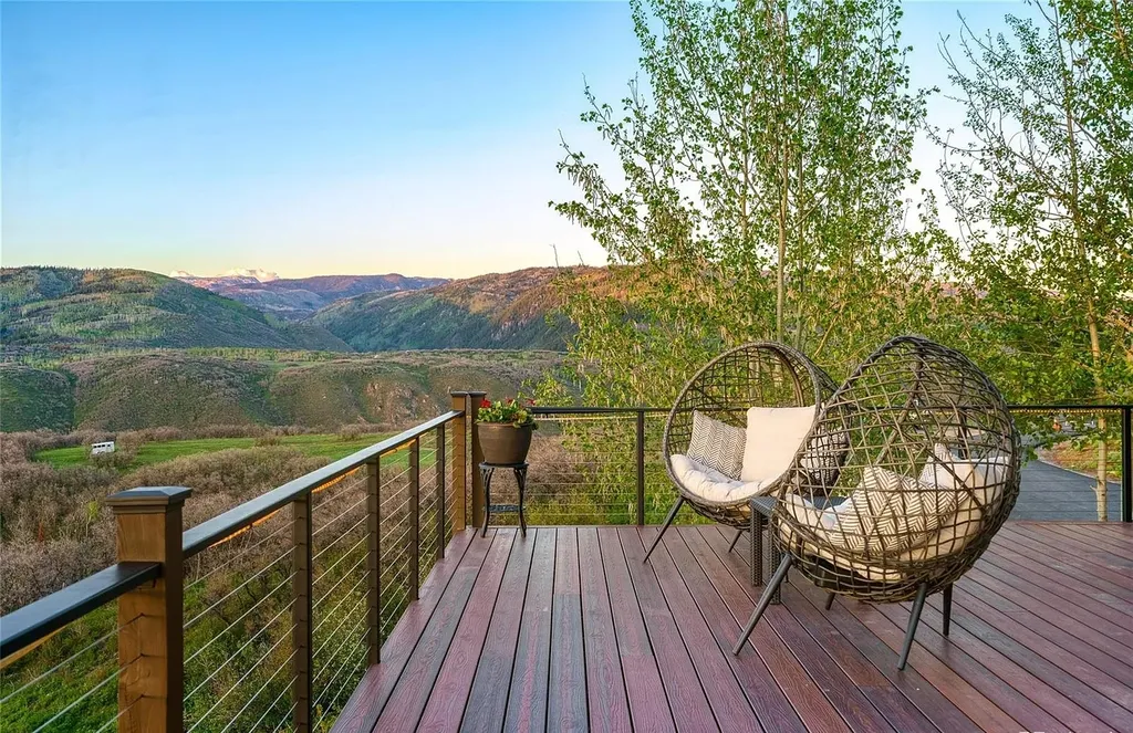 45200 Diamondback Way Home in Steamboat Springs, Colorado. Escape to a tranquil mountain retreat on Diamondback Way, offering breathtaking views and complete privacy just minutes from downtown Steamboat. This expansive property boasts 40 acres, hiking trails, and outdoor living spaces. The home features a great room with vaulted ceilings, a central kitchen for entertaining, and 6 bedrooms including primary suites. Enjoy the outdoors with a fire pit, hot tub, and acres of land for recreation. Horses are welcome, and the property has a high-producing well. Embrace the beauty of Steamboat's natural surroundings at this remarkable retreat.