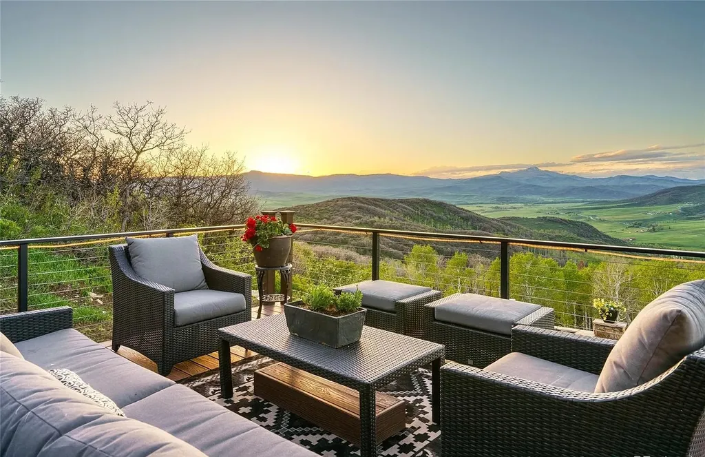 45200 Diamondback Way Home in Steamboat Springs, Colorado. Escape to a tranquil mountain retreat on Diamondback Way, offering breathtaking views and complete privacy just minutes from downtown Steamboat. This expansive property boasts 40 acres, hiking trails, and outdoor living spaces. The home features a great room with vaulted ceilings, a central kitchen for entertaining, and 6 bedrooms including primary suites. Enjoy the outdoors with a fire pit, hot tub, and acres of land for recreation. Horses are welcome, and the property has a high-producing well. Embrace the beauty of Steamboat's natural surroundings at this remarkable retreat.