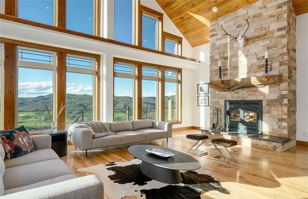 45200 Diamondback Way Home in Steamboat Springs, Colorado. Escape to a tranquil mountain retreat on Diamondback Way, offering breathtaking views and complete privacy just minutes from downtown Steamboat. This expansive property boasts 40 acres, hiking trails, and outdoor living spaces. The home features a great room with vaulted ceilings, a central kitchen for entertaining, and 6 bedrooms including primary suites. Enjoy the outdoors with a fire pit, hot tub, and acres of land for recreation. Horses are welcome, and the property has a high-producing well. Embrace the beauty of Steamboat's natural surroundings at this remarkable retreat.