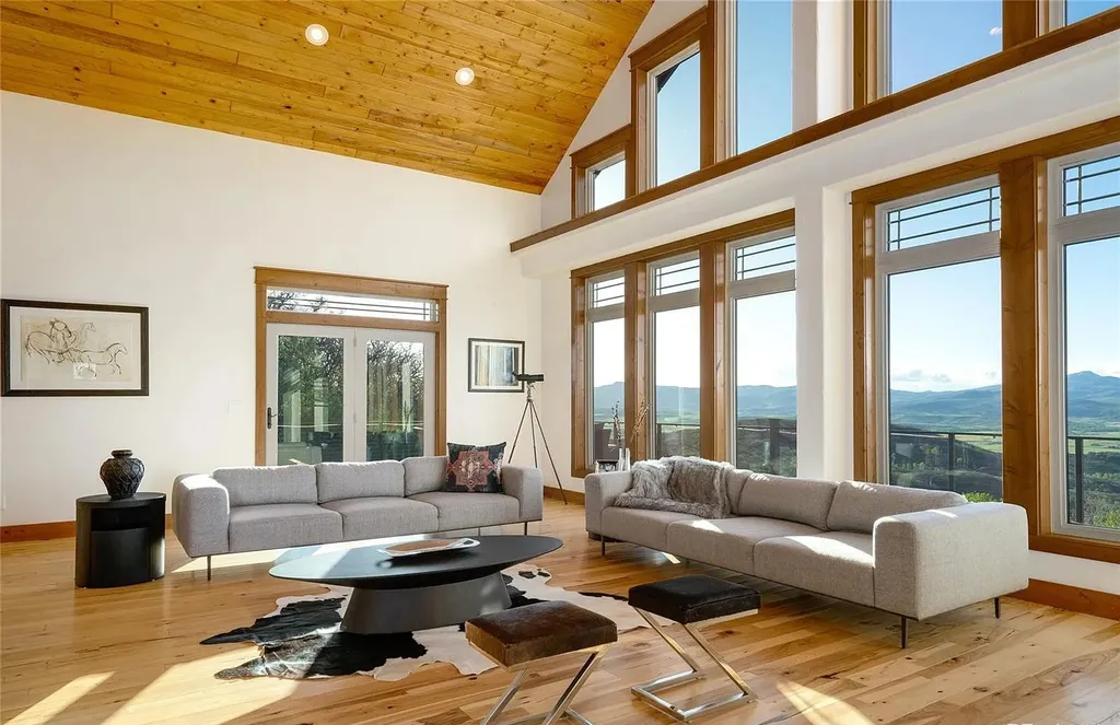 45200 Diamondback Way Home in Steamboat Springs, Colorado. Escape to a tranquil mountain retreat on Diamondback Way, offering breathtaking views and complete privacy just minutes from downtown Steamboat. This expansive property boasts 40 acres, hiking trails, and outdoor living spaces. The home features a great room with vaulted ceilings, a central kitchen for entertaining, and 6 bedrooms including primary suites. Enjoy the outdoors with a fire pit, hot tub, and acres of land for recreation. Horses are welcome, and the property has a high-producing well. Embrace the beauty of Steamboat's natural surroundings at this remarkable retreat.