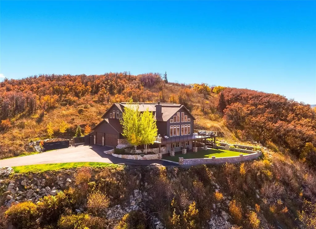 45200 Diamondback Way Home in Steamboat Springs, Colorado. Escape to a tranquil mountain retreat on Diamondback Way, offering breathtaking views and complete privacy just minutes from downtown Steamboat. This expansive property boasts 40 acres, hiking trails, and outdoor living spaces. The home features a great room with vaulted ceilings, a central kitchen for entertaining, and 6 bedrooms including primary suites. Enjoy the outdoors with a fire pit, hot tub, and acres of land for recreation. Horses are welcome, and the property has a high-producing well. Embrace the beauty of Steamboat's natural surroundings at this remarkable retreat.