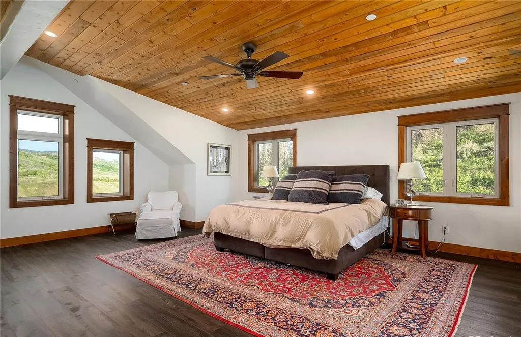 45200 Diamondback Way Home in Steamboat Springs, Colorado. Escape to a tranquil mountain retreat on Diamondback Way, offering breathtaking views and complete privacy just minutes from downtown Steamboat. This expansive property boasts 40 acres, hiking trails, and outdoor living spaces. The home features a great room with vaulted ceilings, a central kitchen for entertaining, and 6 bedrooms including primary suites. Enjoy the outdoors with a fire pit, hot tub, and acres of land for recreation. Horses are welcome, and the property has a high-producing well. Embrace the beauty of Steamboat's natural surroundings at this remarkable retreat.