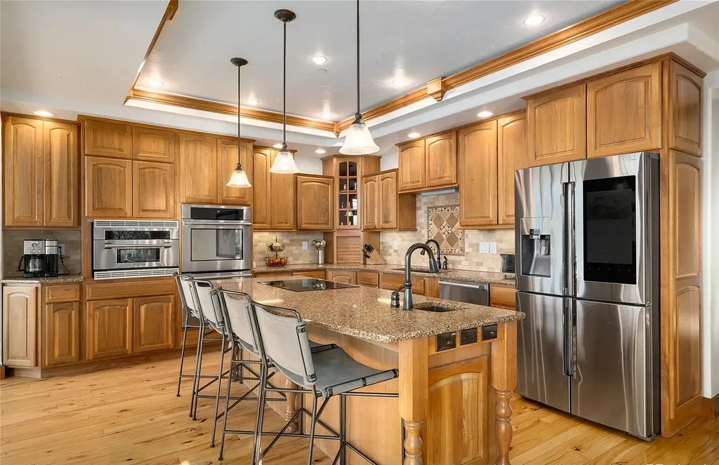 45200 Diamondback Way Home in Steamboat Springs, Colorado. Escape to a tranquil mountain retreat on Diamondback Way, offering breathtaking views and complete privacy just minutes from downtown Steamboat. This expansive property boasts 40 acres, hiking trails, and outdoor living spaces. The home features a great room with vaulted ceilings, a central kitchen for entertaining, and 6 bedrooms including primary suites. Enjoy the outdoors with a fire pit, hot tub, and acres of land for recreation. Horses are welcome, and the property has a high-producing well. Embrace the beauty of Steamboat's natural surroundings at this remarkable retreat.