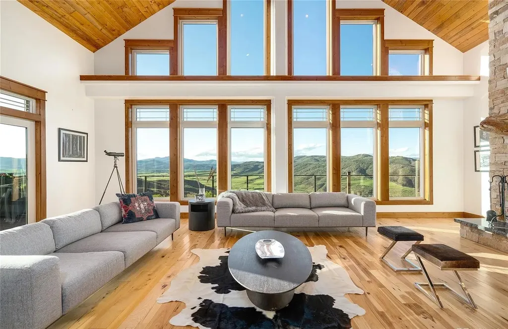 45200 Diamondback Way Home in Steamboat Springs, Colorado. Escape to a tranquil mountain retreat on Diamondback Way, offering breathtaking views and complete privacy just minutes from downtown Steamboat. This expansive property boasts 40 acres, hiking trails, and outdoor living spaces. The home features a great room with vaulted ceilings, a central kitchen for entertaining, and 6 bedrooms including primary suites. Enjoy the outdoors with a fire pit, hot tub, and acres of land for recreation. Horses are welcome, and the property has a high-producing well. Embrace the beauty of Steamboat's natural surroundings at this remarkable retreat.