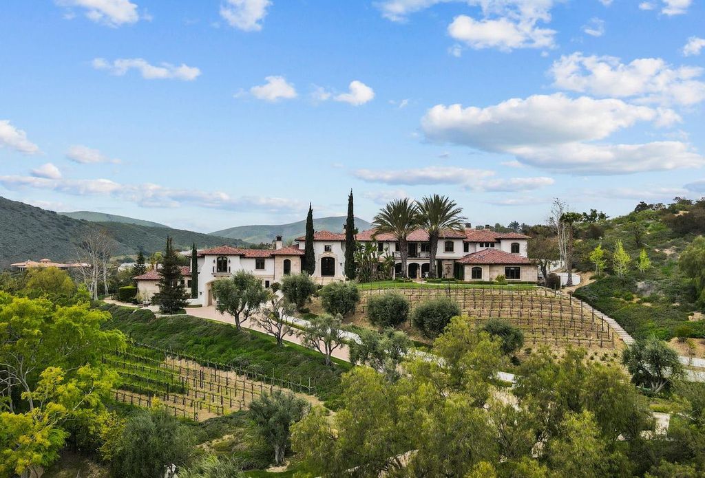 4787 Windhaven Drive Home in Thousand Oaks, California. Windhaven Vineyard Estate is a luxurious Mediterranean palace located in the guard-gated community of Country Club Estates. The estate sits on nearly 5 acres with stunning views of mountains, vineyards, and a golf course. 
