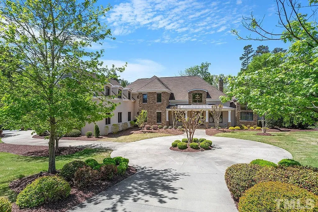 6205 Autrey Court Home in Raleigh, North Carolina. Experience the ultimate staycation in this magnificent home that exudes elegance and offers a host of luxurious features. A recent kitchen refresh showcases stunning quartz countertops and backsplash, complemented by new appliances. The integration of Control 4 Home Automation allows for seamless control of various systems within the home. Fresh paint, updated fixtures, and new carpet throughout create a fresh and inviting ambiance.